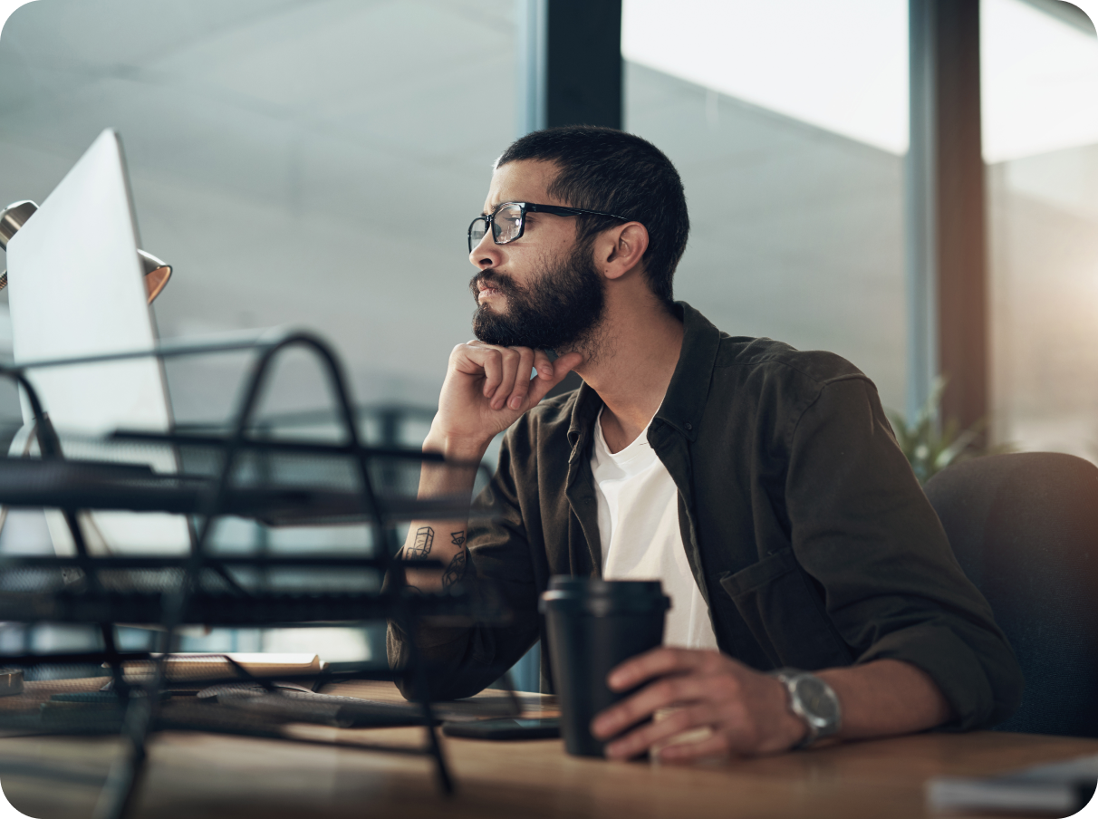 Guy working at his desk